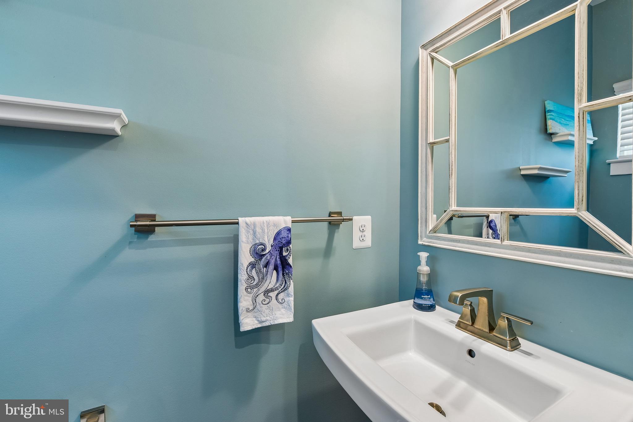 637 Iron Gate Road Bel Air, MD 21014 - Photo 11 of 35 a bathroom with a sink and mirror