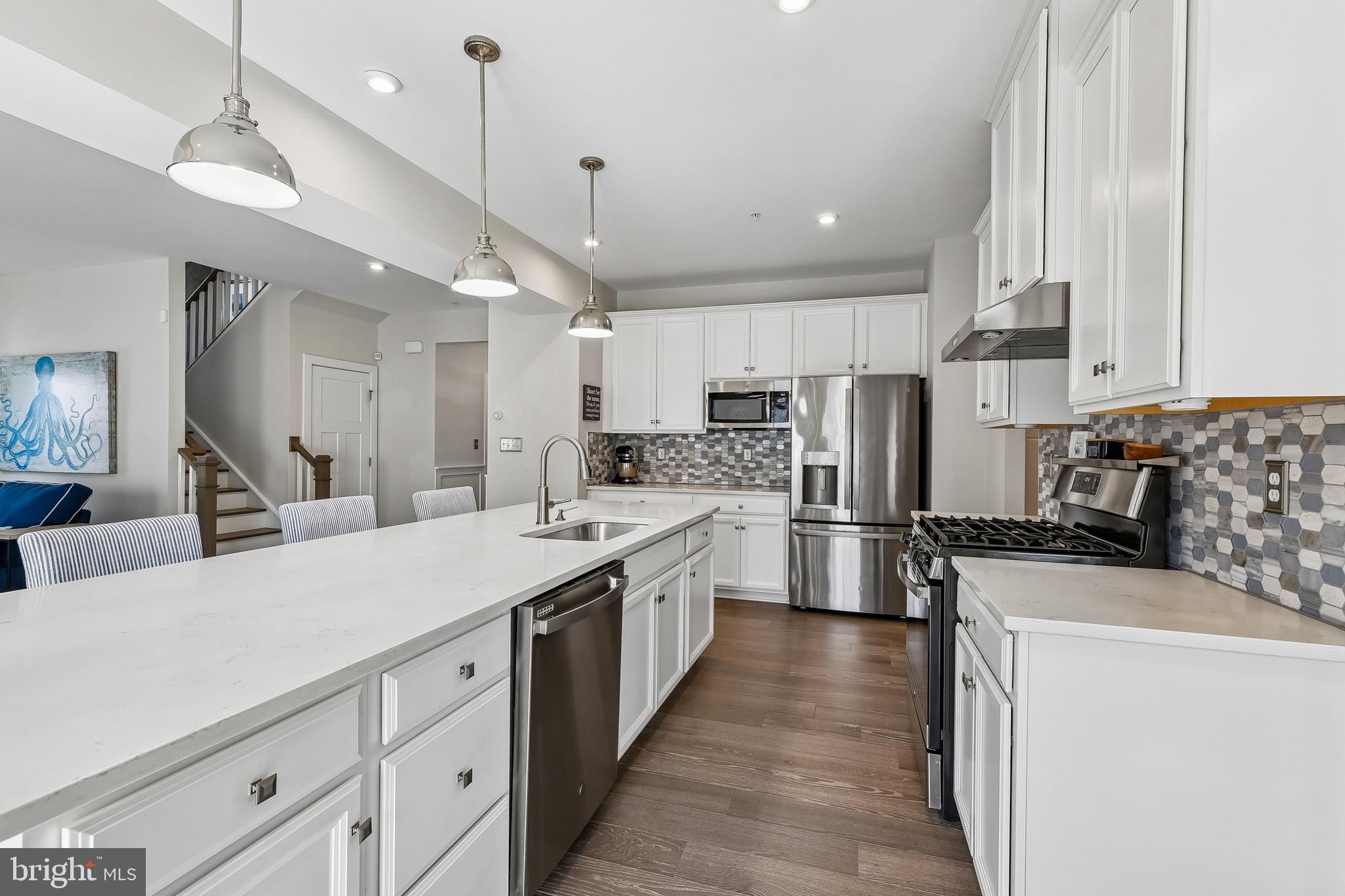 637 Iron Gate Road Bel Air, MD 21014 - Photo 6 of 35 a kitchen with stainless steel appliances kitchen island a refrigerator sink and cabinets