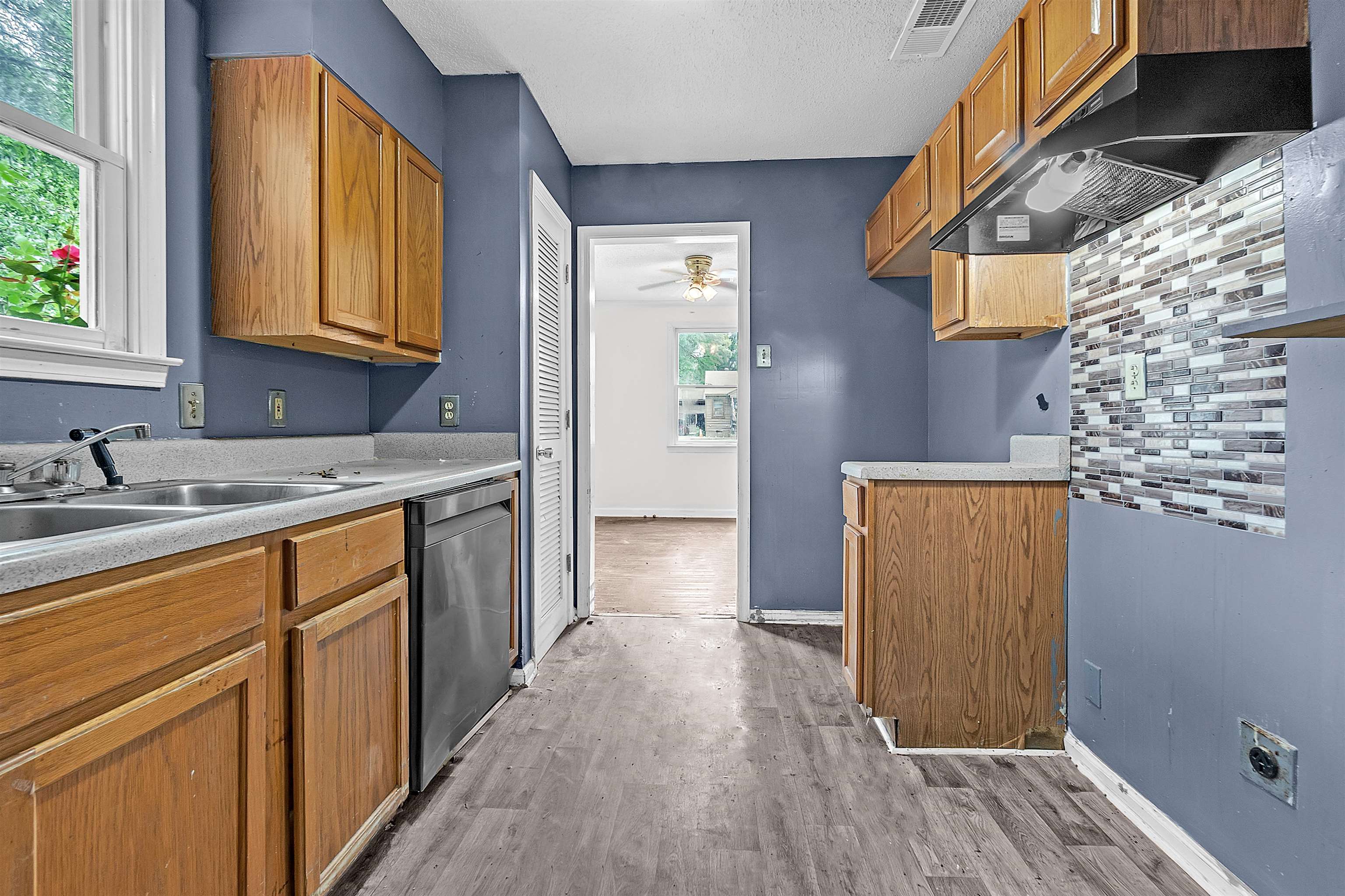 1013 Waring Road Memphis, TN 38122 - Photo 6 of 11 a view of a kitchen with wooden floor and a sink