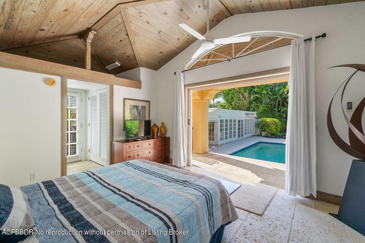 257 Fairview Road Palm Beach, FL 33480 - Photo 17 of 20 a bedroom with a bed and a window