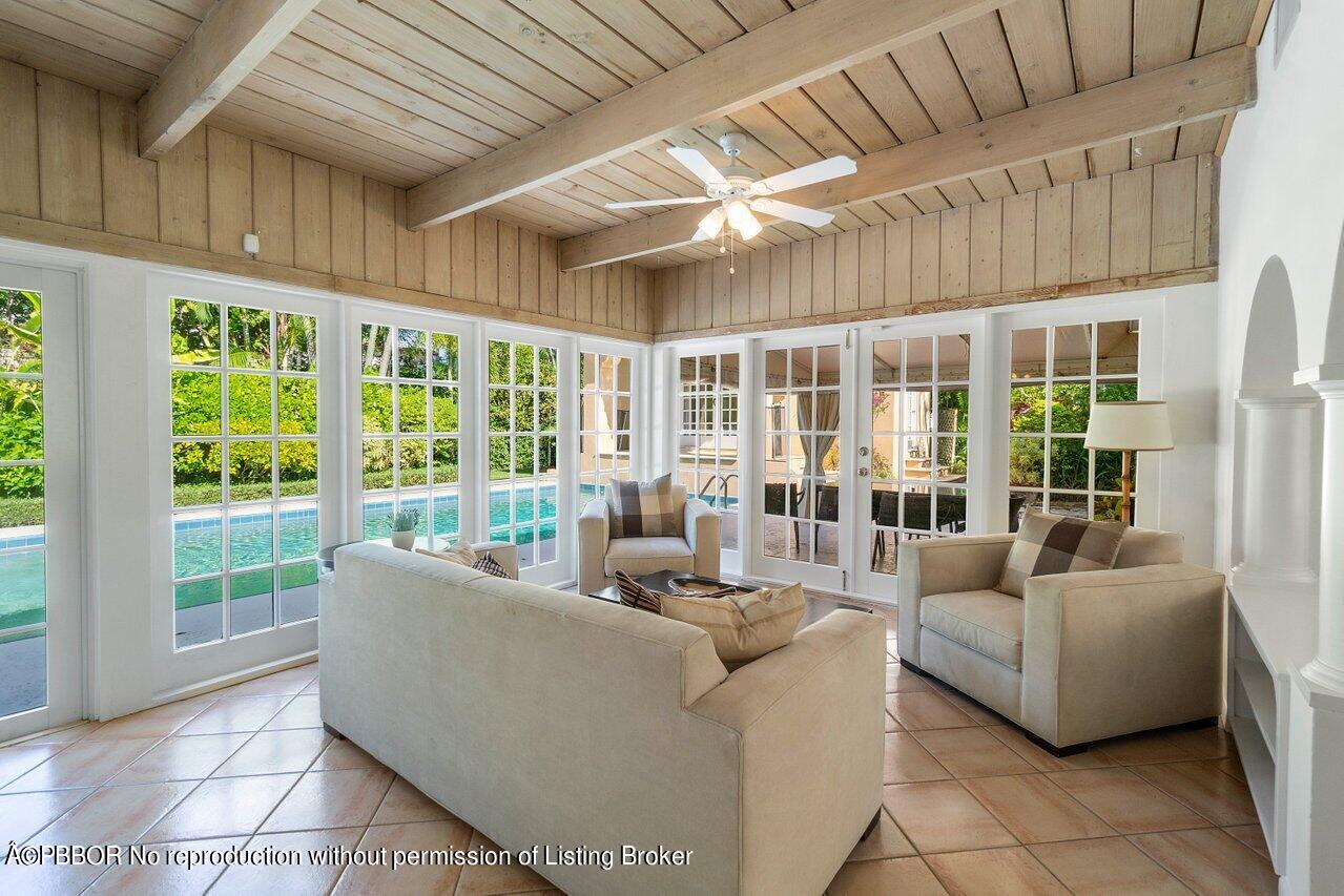 257 Fairview Road Palm Beach, FL 33480 - Photo 5 of 20 a living room with furniture and floor to ceiling windows