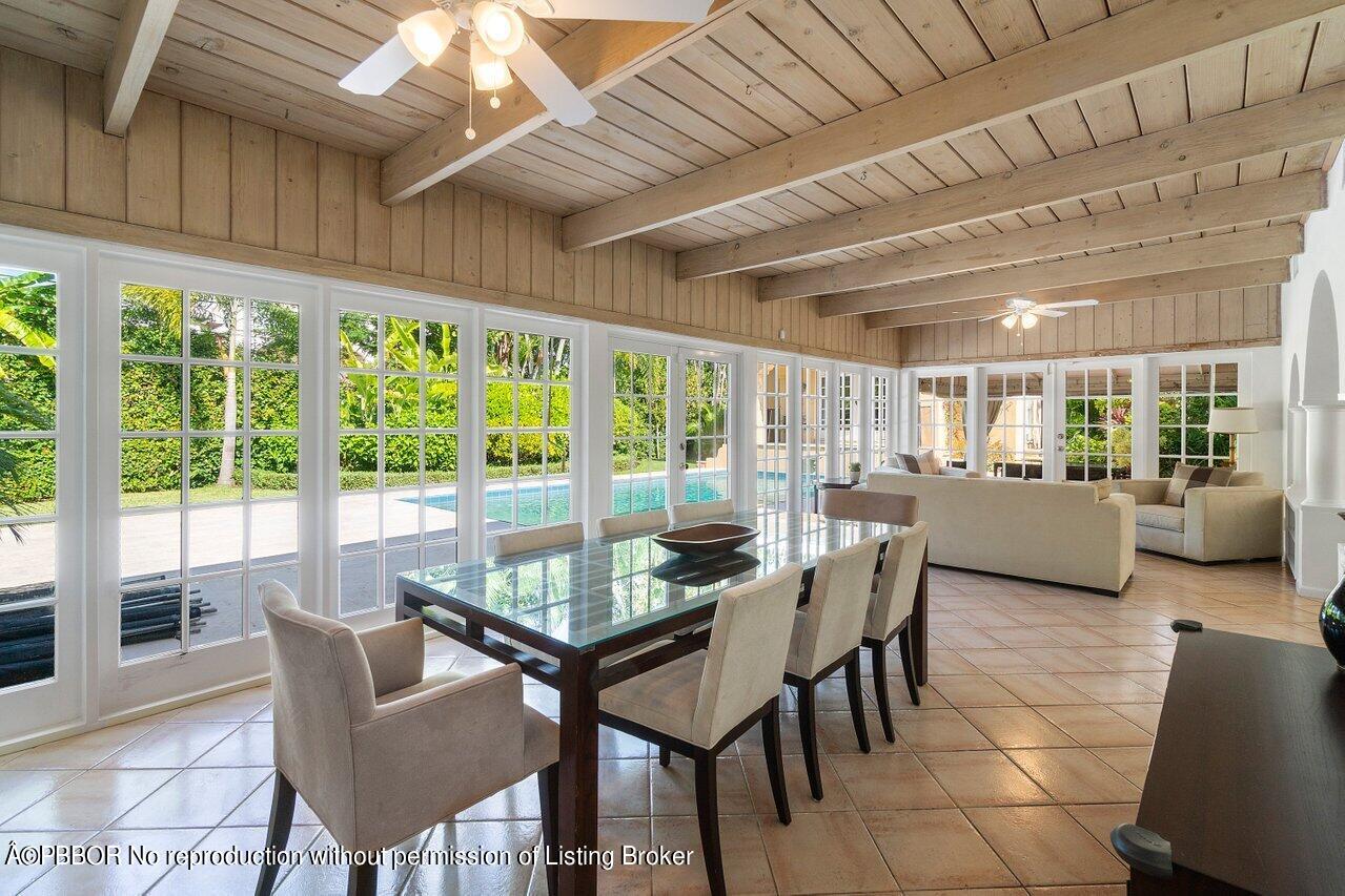 257 Fairview Road Palm Beach, FL 33480 - Photo 6 of 20 a dining room with furniture and a floor to ceiling window