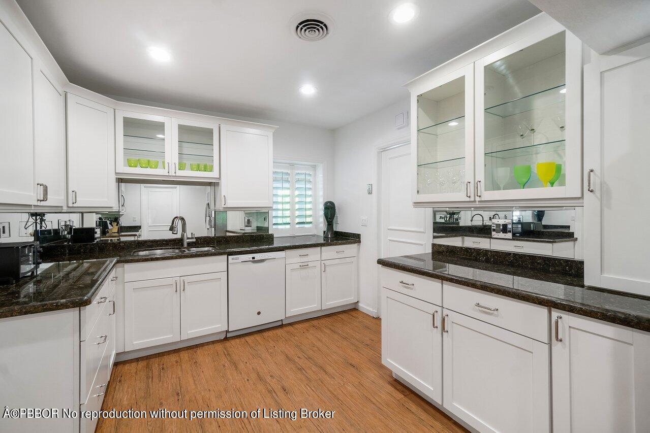 257 Fairview Road Palm Beach, FL 33480 - Photo 8 of 20 a kitchen with stainless steel appliances granite countertop a sink and a stove