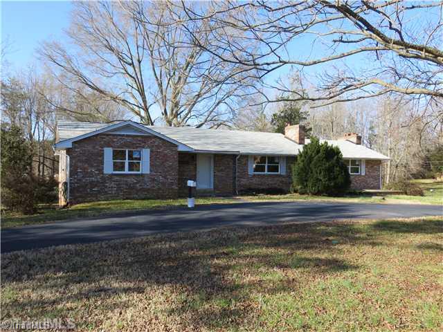 1859 Underpass Road Advance, NC 27006 - Photo 1 of 16 Exterior Front. Paved circle drive off Underpass or paved driveway to garage parking in the back. Nice patio space to the right of the home.