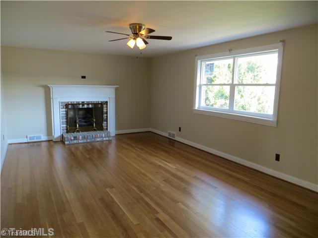 1859 Underpass Road Advance, NC 27006 - Photo 3 of 16 Living Room. Two arched doorways lead into the living room from the kitchen and entry.