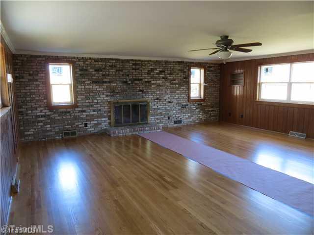 1859 Underpass Road Advance, NC 27006 - Photo 7 of 16 Den/Family/Great Room. A monster room great for family entertaining space. Separate exterior door that could be used for entry. Newly refinished floors, new Jeld Wen windows and a wood burning fireplace. Ceilings are smooth and the walls are wormy fir.