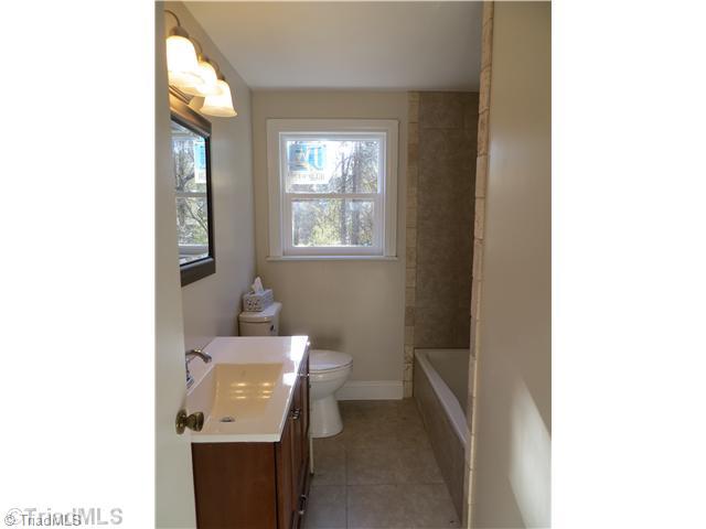 1859 Underpass Road Advance, NC 27006 - Photo 9 of 16 Bath. This bath is just off the master (not an en suite) but perfect in every way. Fresh new tile, new vanity and comfort height toilet.