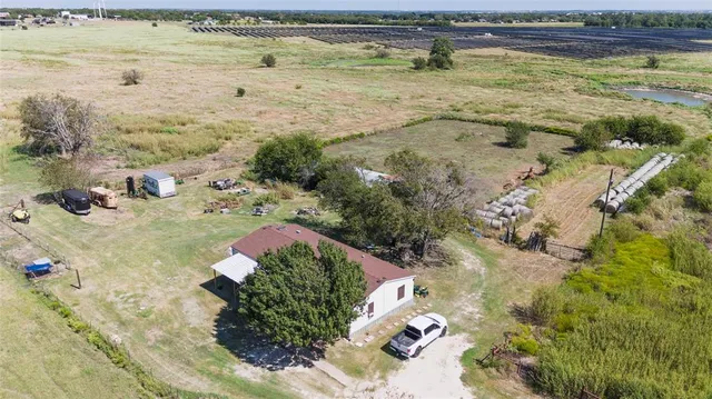 a view of a chairs and table in a patio