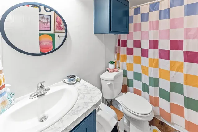 a living room with furniture a air conditioner vent and a window