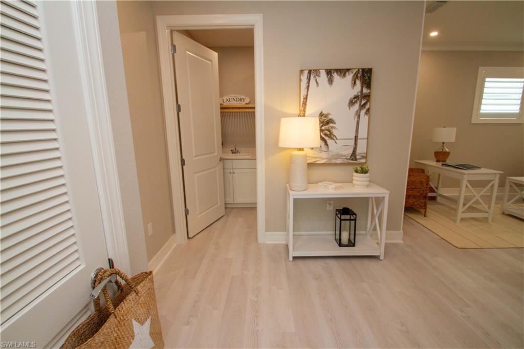 251 Indies Drive East, Unit 202 Naples, FL 34114 - Photo 25 of 48 a view of a workspace with furniture and a window