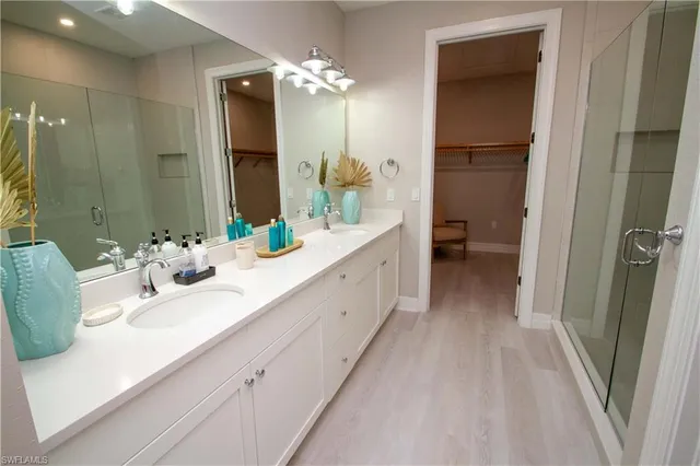 a bathroom with a shower curtain and a sink