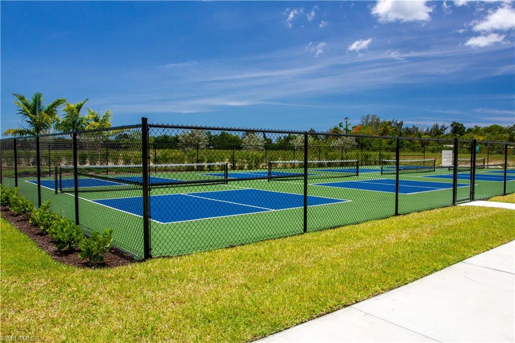 251 Indies Drive East, Unit 202 Naples, FL 34114 - Photo 47 of 48 a view of an outdoor space and swimming pool