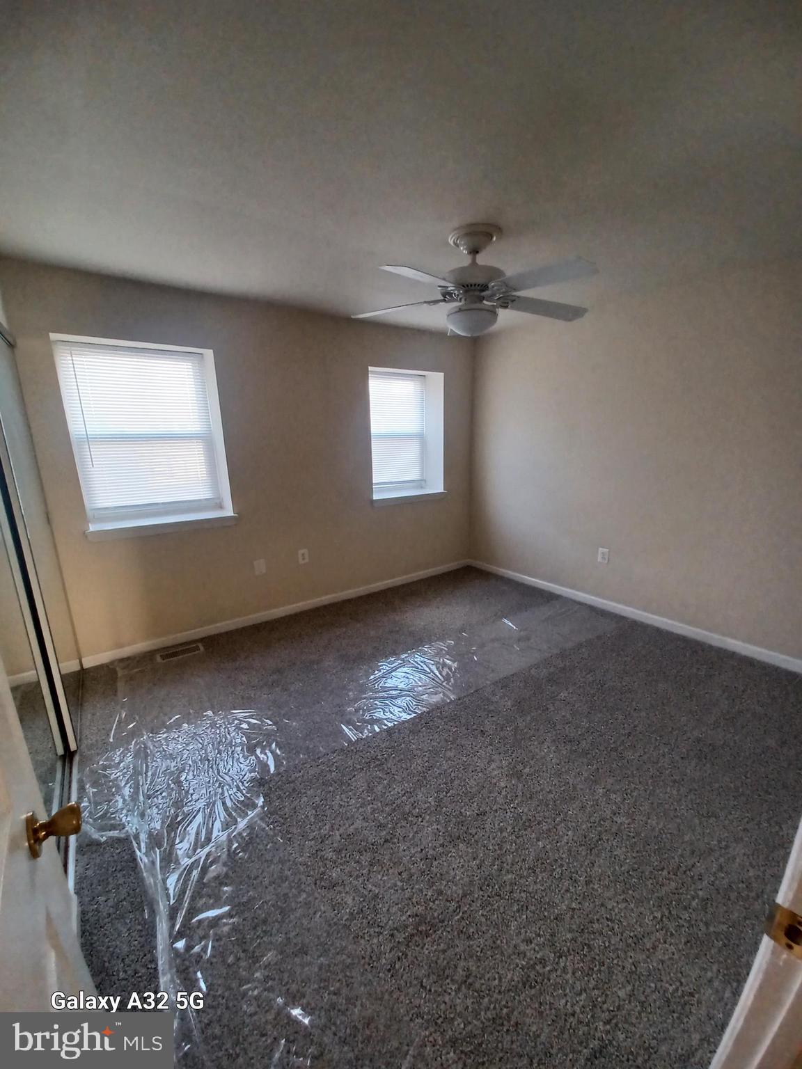 8213 Coatsbridge Court Severn, MD 21144 - Photo 11 of 19 en empty room with windows