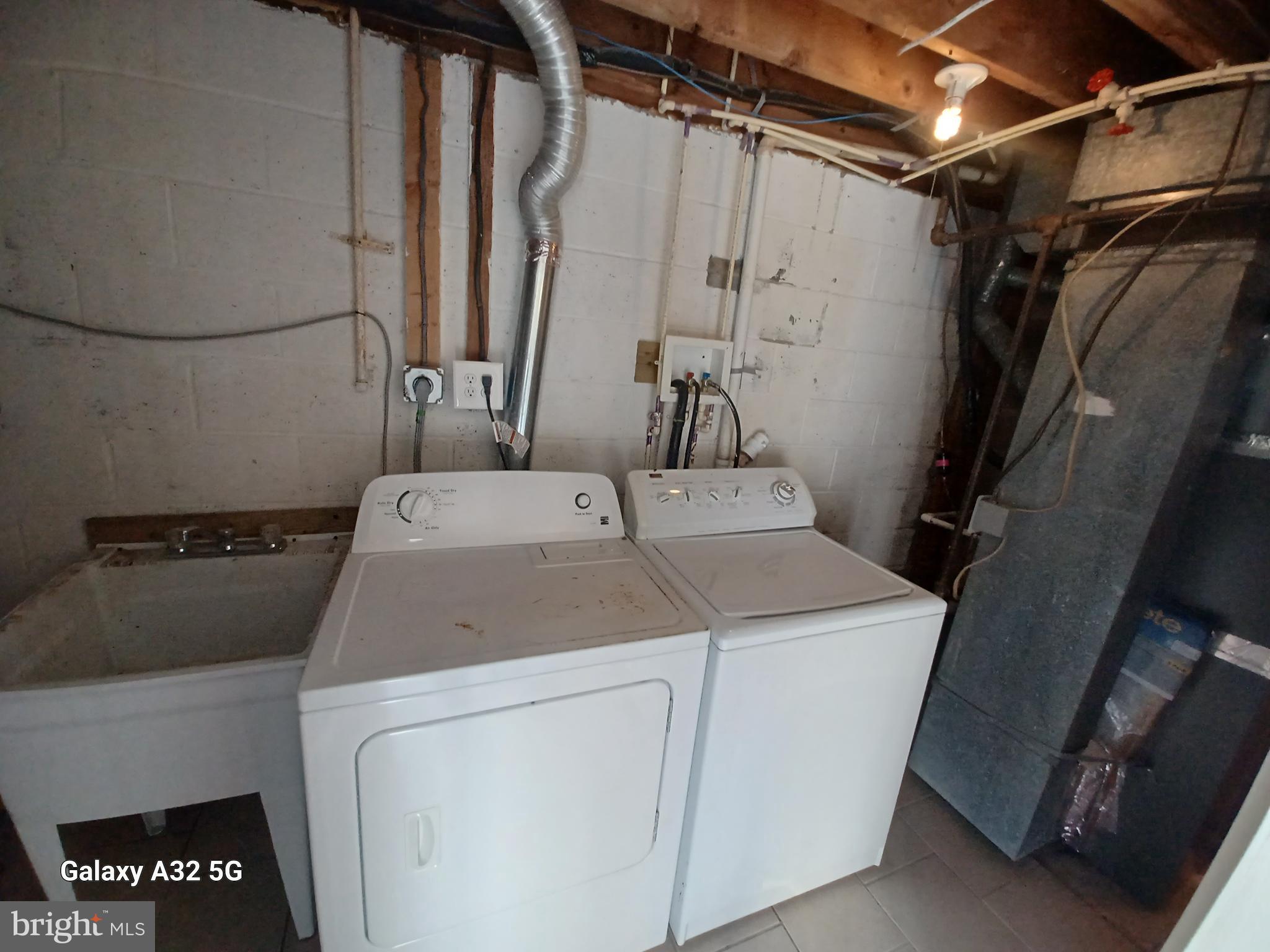 8213 Coatsbridge Court Severn, MD 21144 - Photo 16 of 19 a utility room with dryer and washer