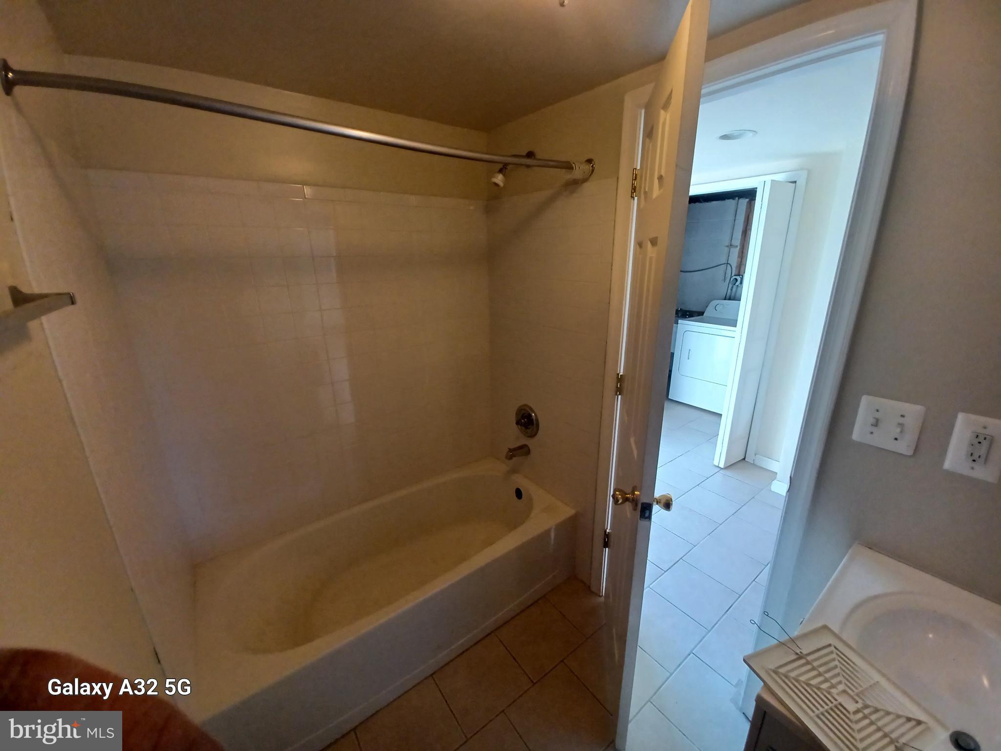 8213 Coatsbridge Court Severn, MD 21144 - Photo 17 of 19 a bathroom with a bathtub