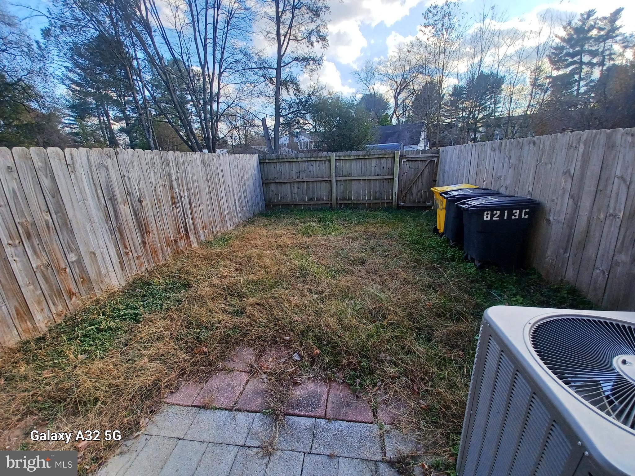 8213 Coatsbridge Court Severn, MD 21144 - Photo 19 of 19 a view of a backyard with a small cabin and a chair