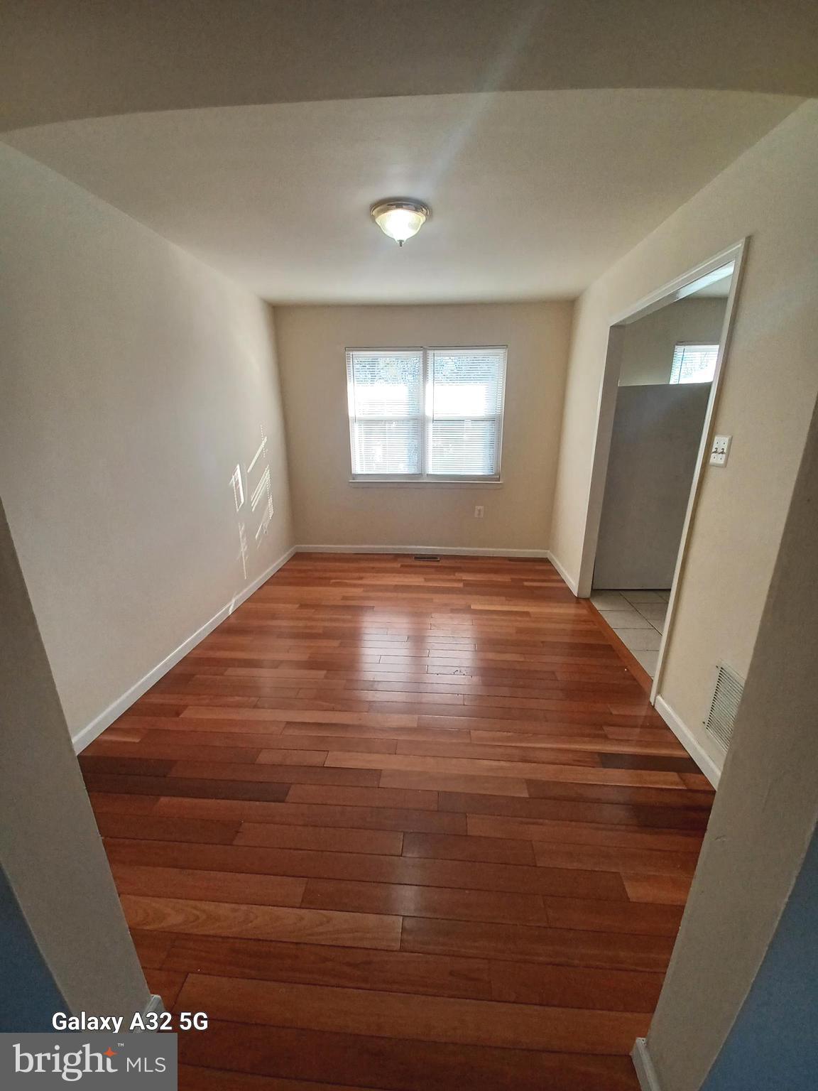 8213 Coatsbridge Court Severn, MD 21144 - Photo 4 of 19 a view of an empty room and window