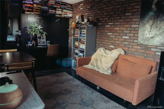a view of a livingroom with furniture and window