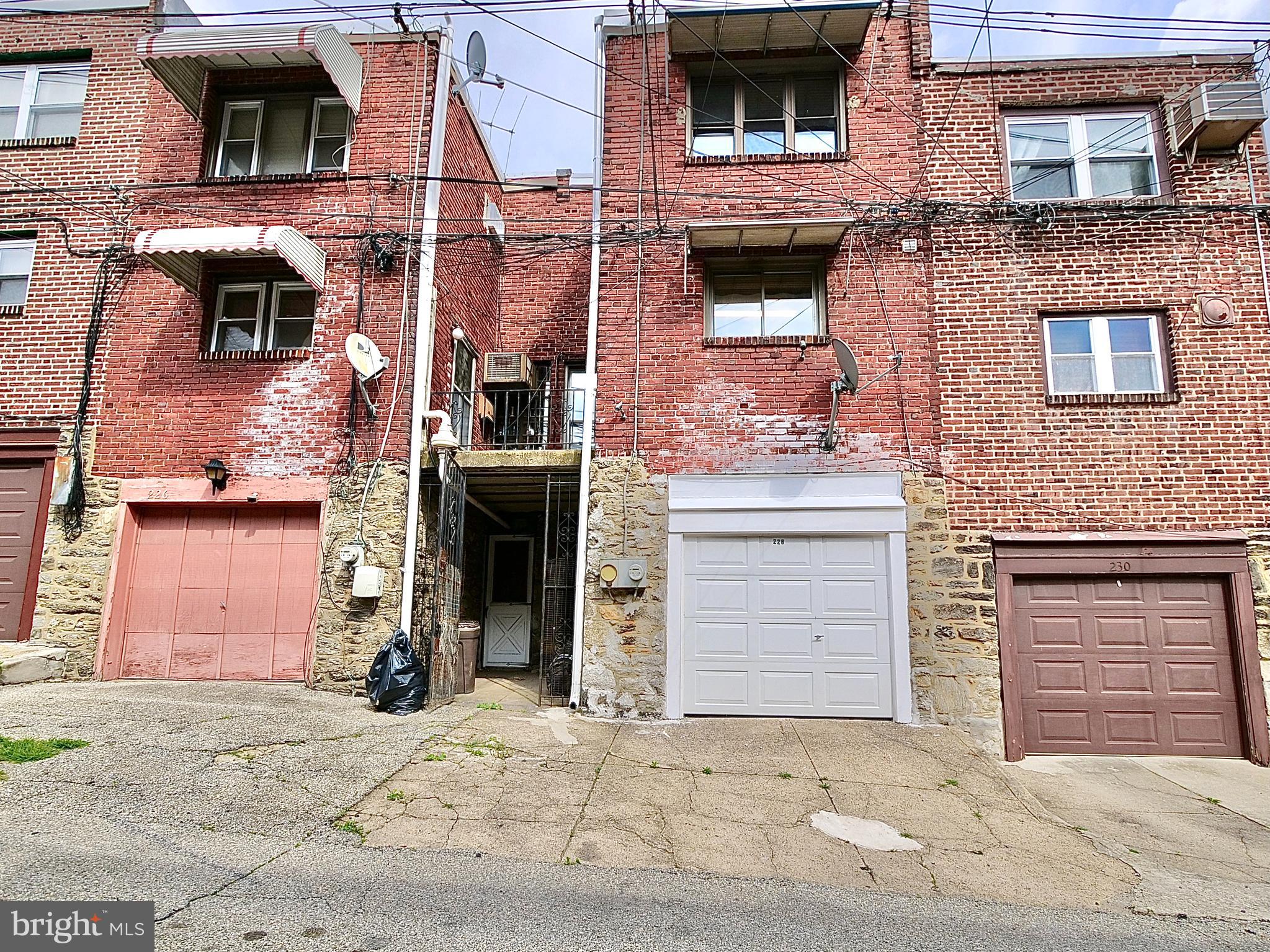 228 Maypole Road Upper Darby, PA 19082 - Photo 19 of 20 Garage Entrance With One car Parking outs side