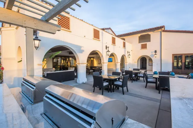 a group of chairs sitting in kitchen and dining area