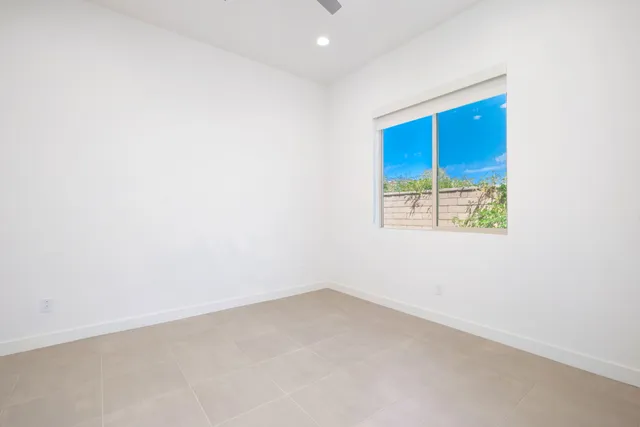 a bathroom with a granite countertop sink mirror and double