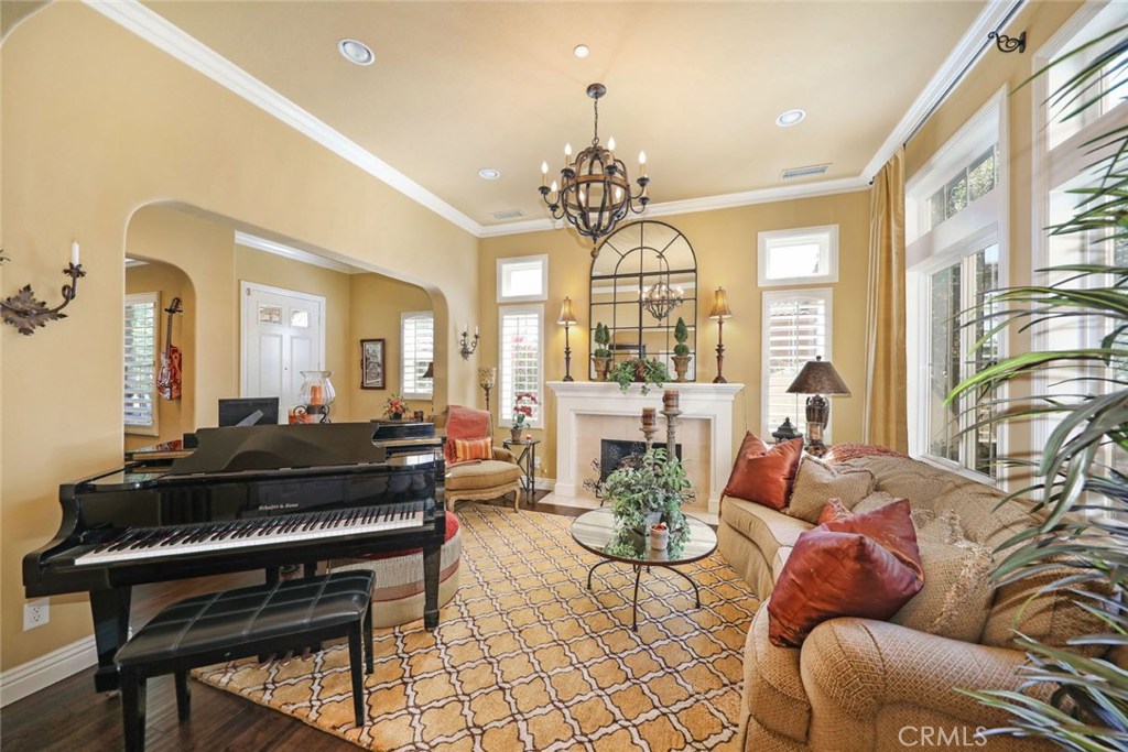 34 Via Cancion San Clemente, CA 92673 - Photo 23 of 39 a living room with furniture chandelier and a large window