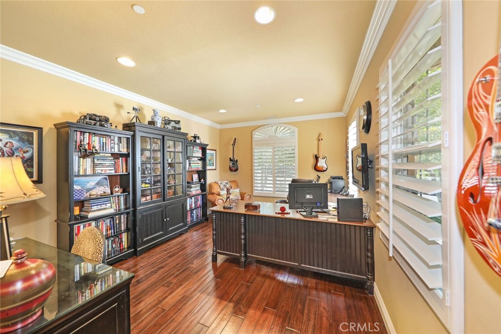 34 Via Cancion San Clemente, CA 92673 - Photo 25 of 39 a room with stainless steel appliances kitchen island granite countertop a refrigerator and wooden floor