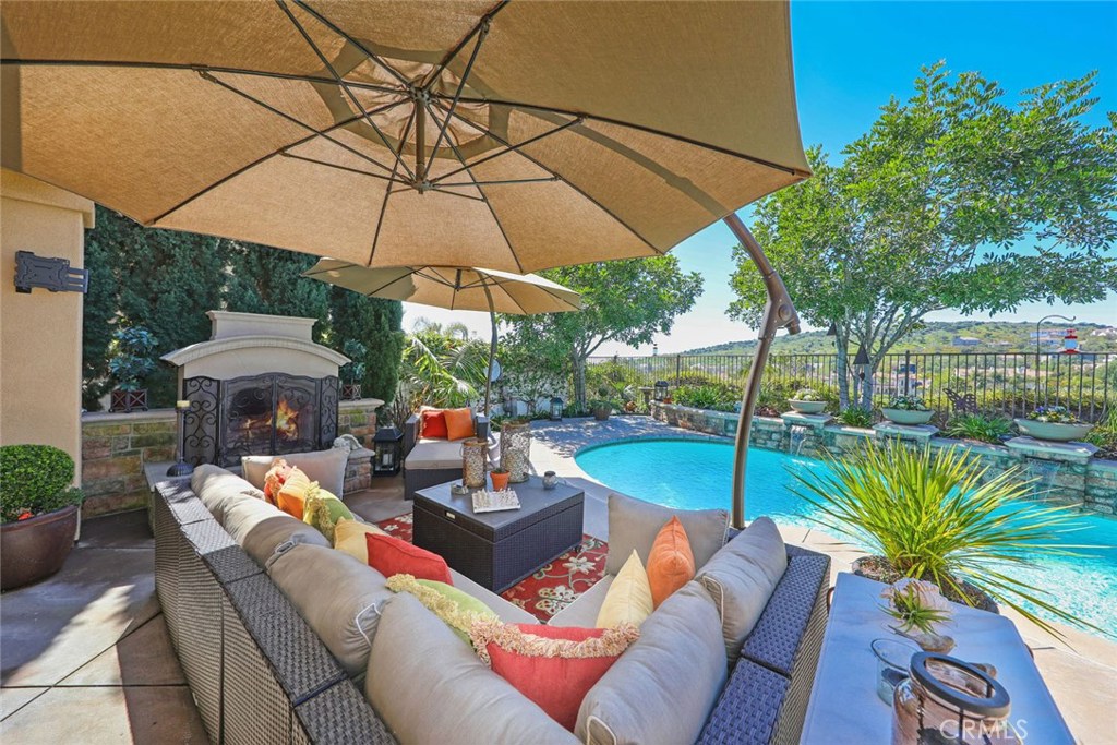 34 Via Cancion San Clemente, CA 92673 - Photo 9 of 39 a outdoor living space with furniture and umbrella