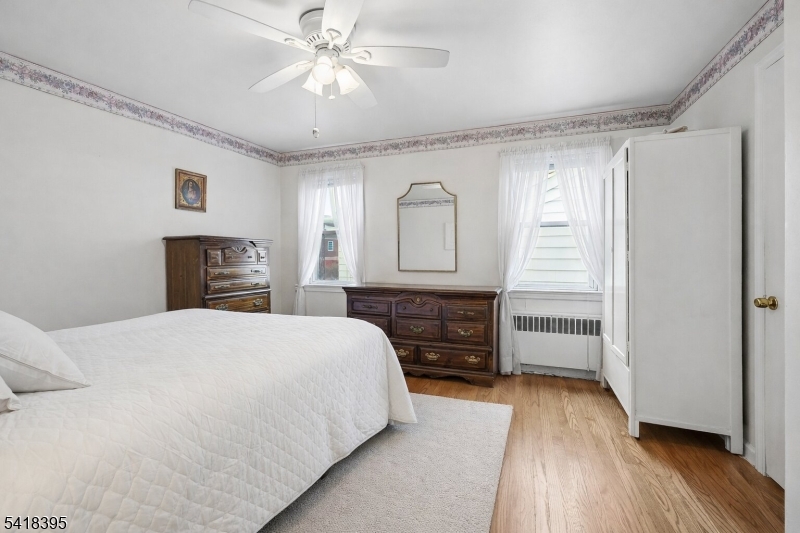 2970 Aberdeen Road Union, NJ 07083 - Photo 12 of 18 a bedroom with a bed and wooden floor