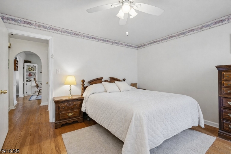 2970 Aberdeen Road Union, NJ 07083 - Photo 13 of 18 a bedroom with a bed and a chandelier