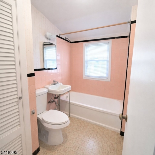 2970 Aberdeen Road Union, NJ 07083 - Photo 17 of 18 a bathroom with a toilet a sink and a mirror