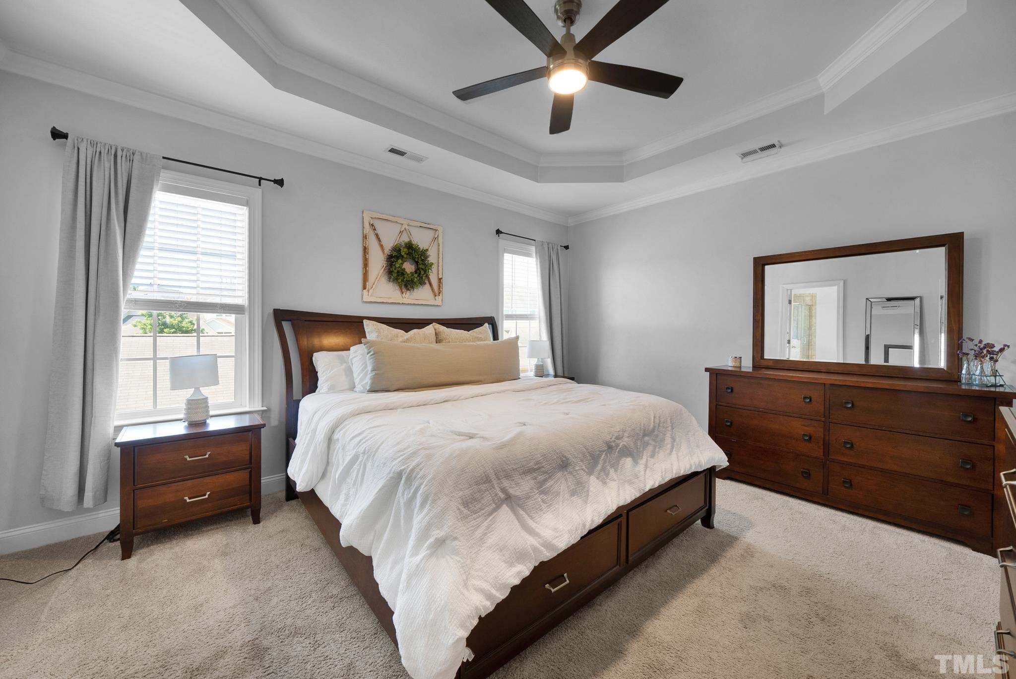 907 Chapanoke Road Raleigh, NC 27603 - Photo 12 of 26 a bedroom with a large bed and a window
