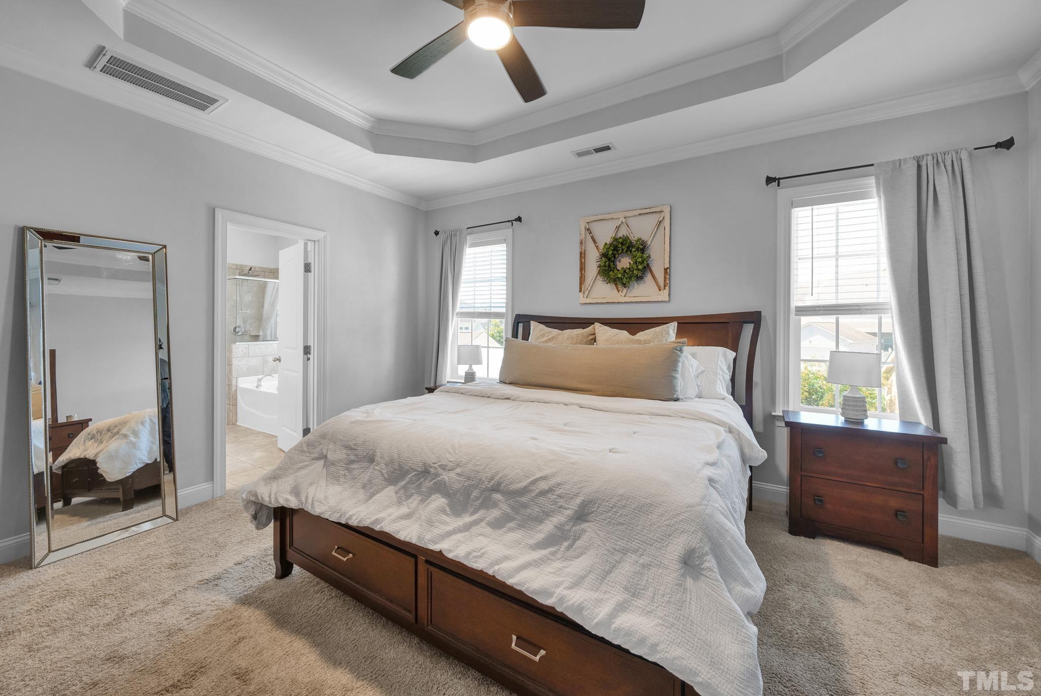 907 Chapanoke Road Raleigh, NC 27603 - Photo 13 of 26 a bedroom with a bed and a large window