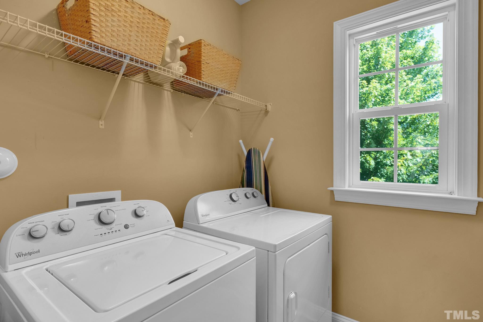 907 Chapanoke Road Raleigh, NC 27603 - Photo 18 of 26 a utility room with dryer and washer