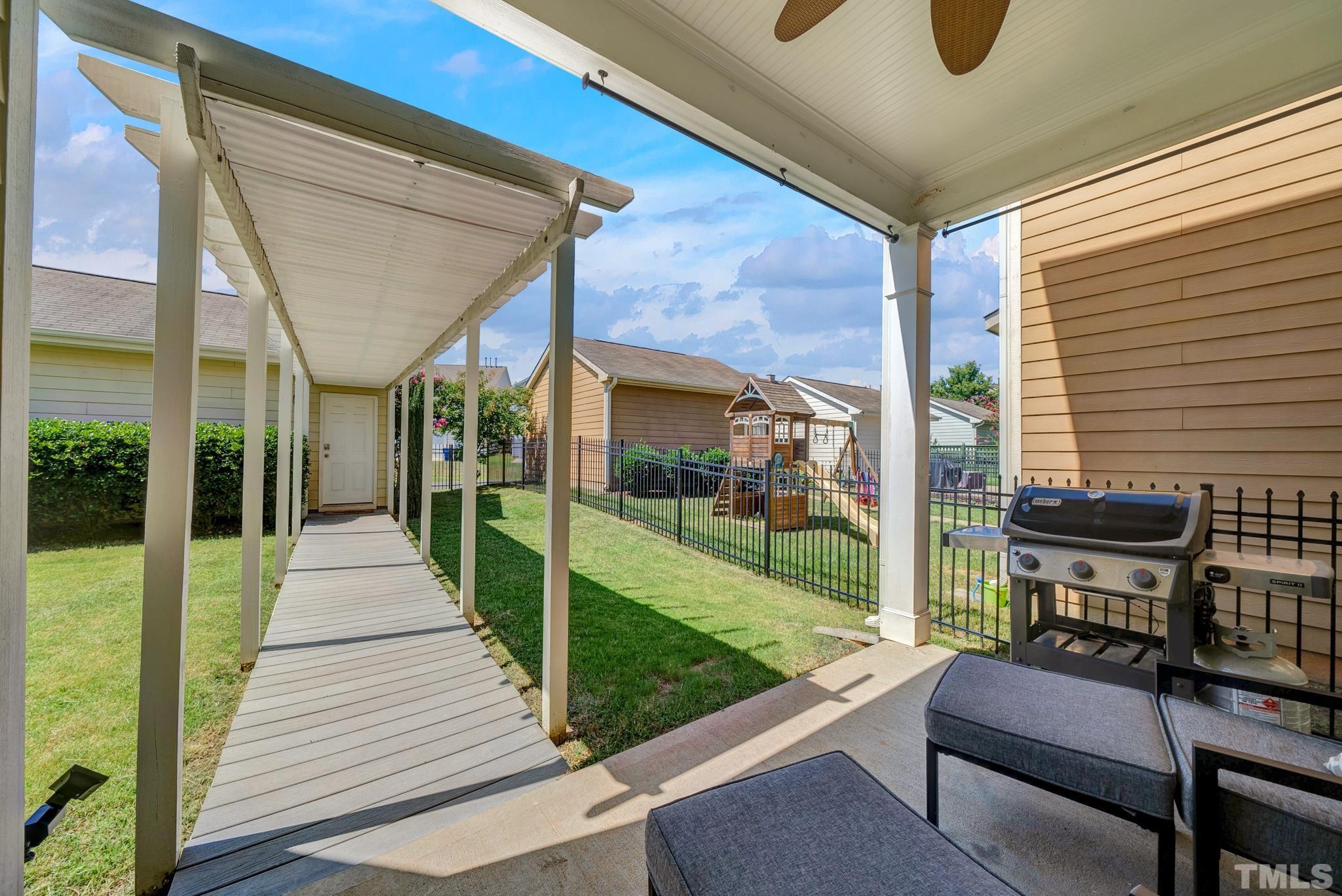 907 Chapanoke Road Raleigh, NC 27603 - Photo 20 of 26 a view of a two chairs in the patio