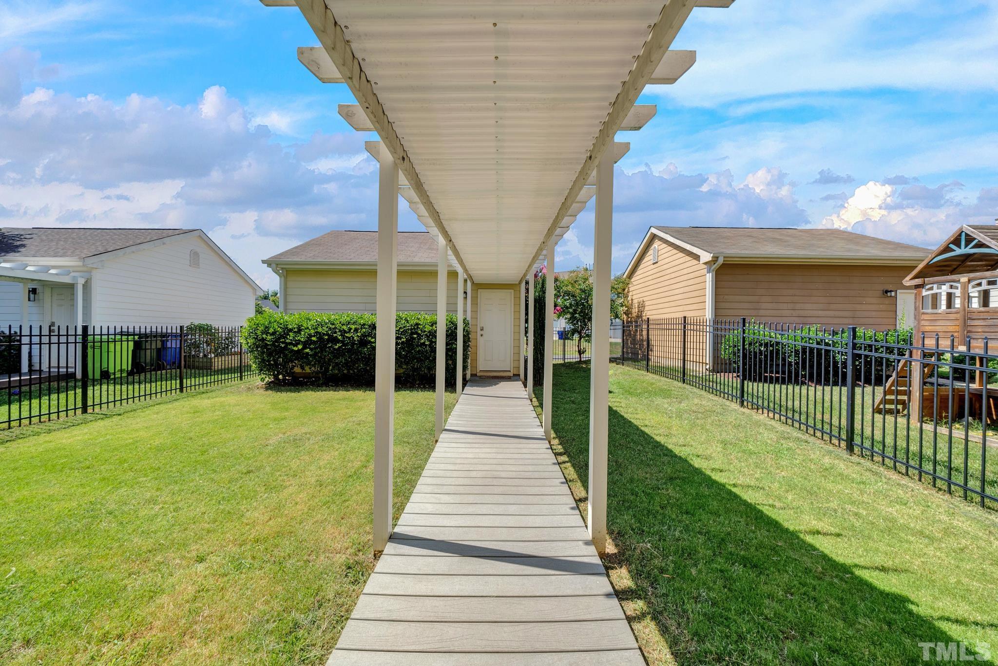 907 Chapanoke Road Raleigh, NC 27603 - Photo 23 of 26 a view of a house with a yard