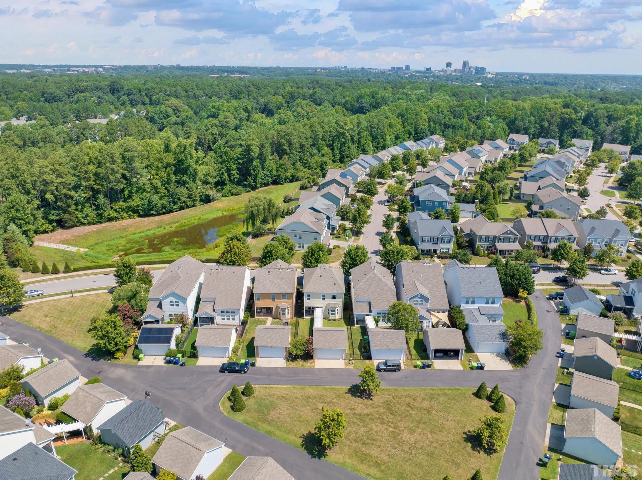 907 Chapanoke Road Raleigh, NC 27603 - Photo 3 of 26 an aerial view of multiple houses with yard