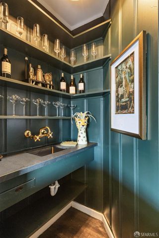 a kitchen with stainless steel appliances granite countertop white cabinets a sink and dishwasher