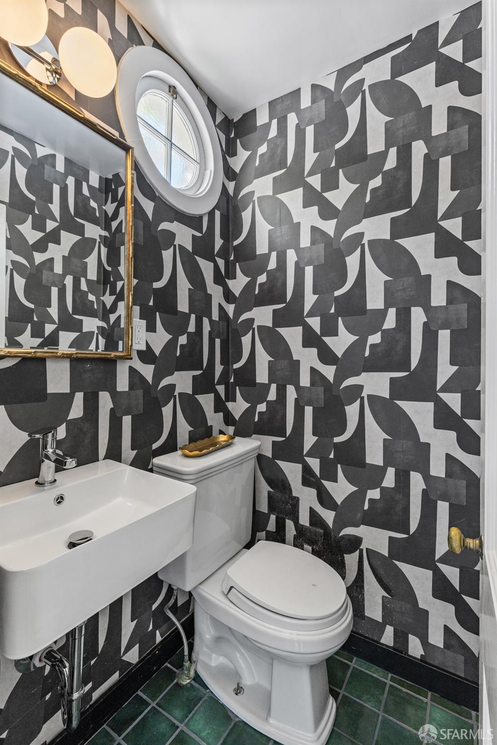 101 Graystone Terrace San Francisco, CA 94114 - Photo 24 of 72 a bathroom with a sink toilet and mirror