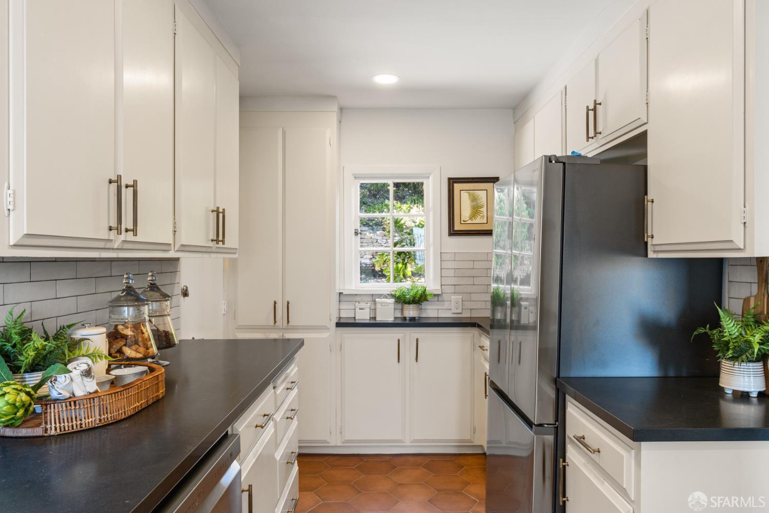 101 Graystone Terrace San Francisco, CA 94114 - Photo 33 of 72 a kitchen with stainless steel appliances granite countertop a sink and a refrigerator