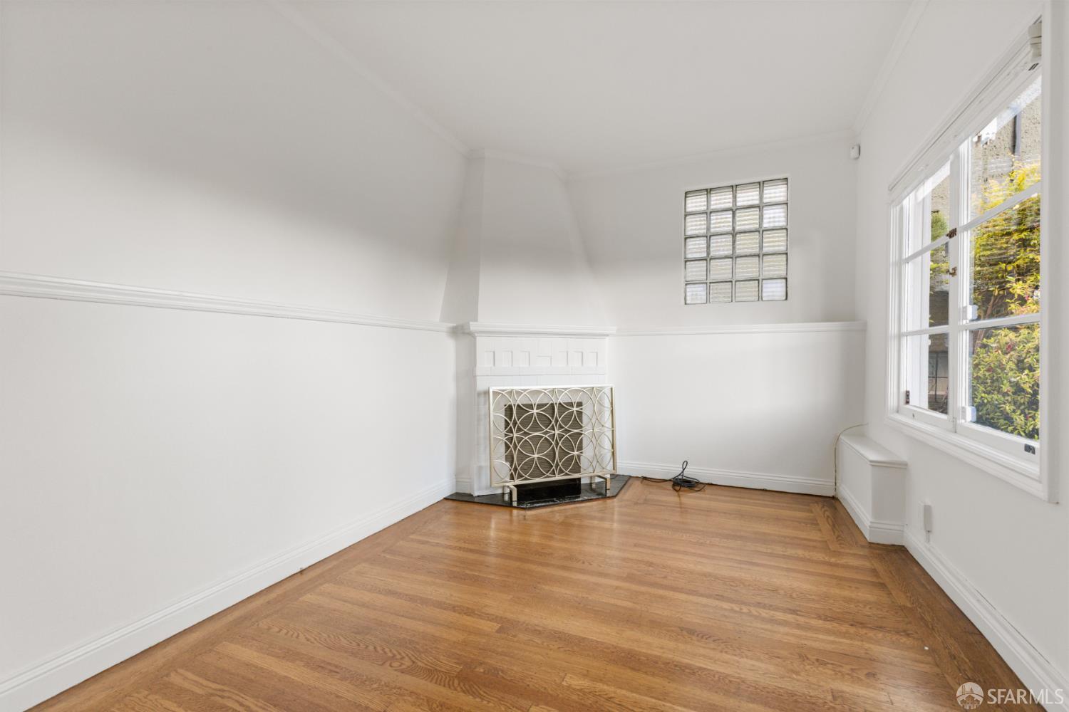 101 Graystone Terrace San Francisco, CA 94114 - Photo 64 of 72 an empty room with wooden floor and windows