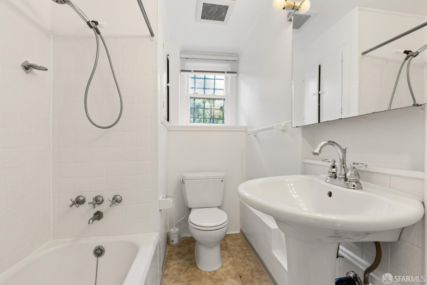 101 Graystone Terrace San Francisco, CA 94114 - Photo 68 of 72 a bathroom with a sink a toilet and shower