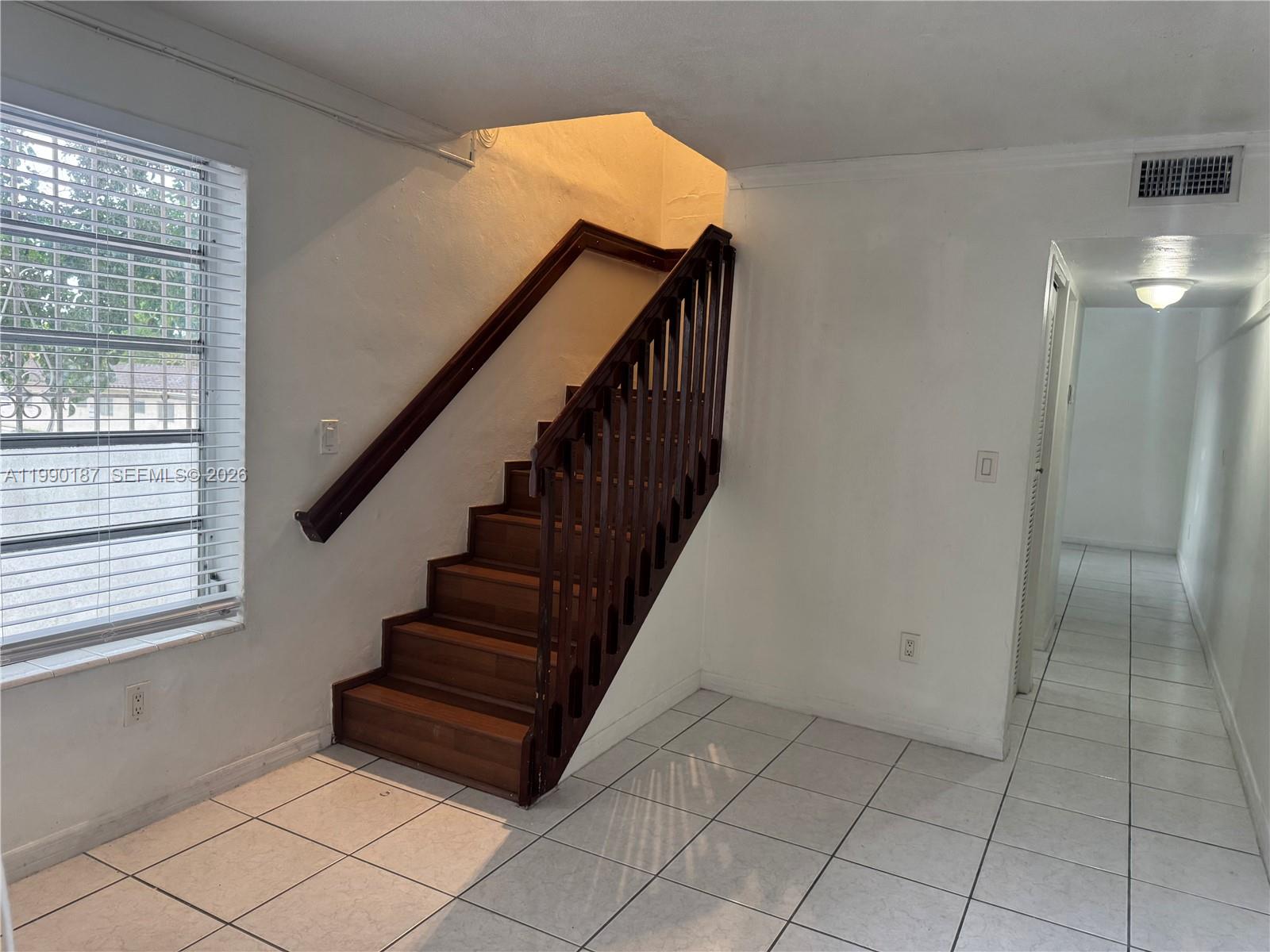 11 Southwest 32nd Avenue, Unit 4 Miami, FL 33135 - Photo 4 of 13 a view of entryway and hall with wooden floor