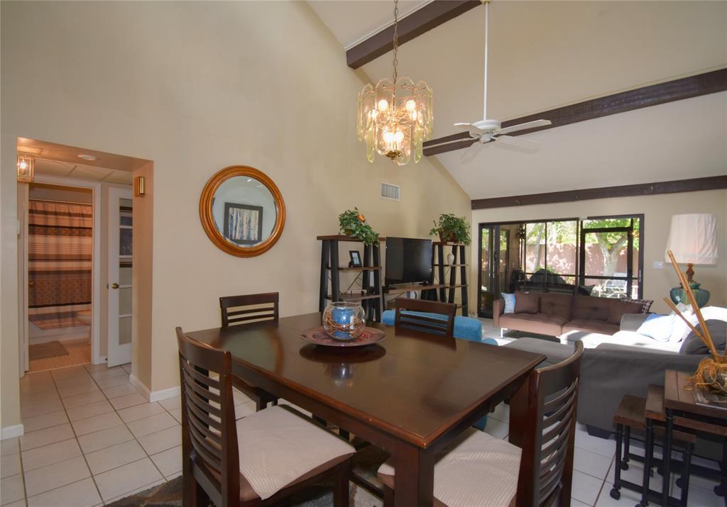 1748 Northwest 74th Avenue, Unit 19 Plantation, FL 33313 - Photo 12 of 44 a view of a dining room with furniture and a large window