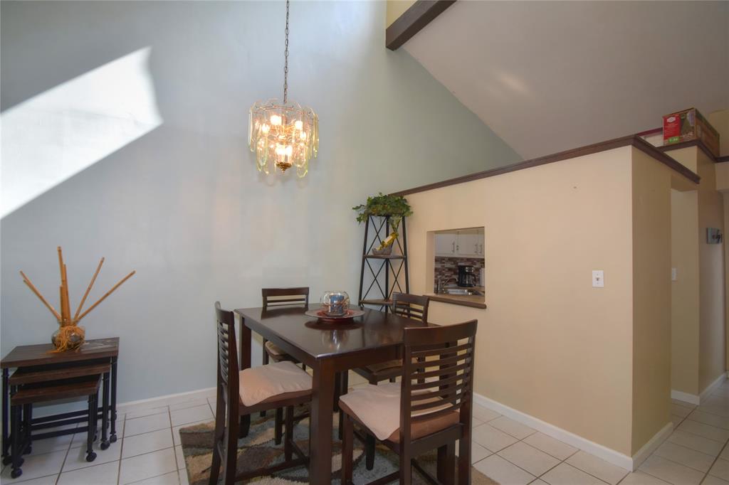 1748 Northwest 74th Avenue, Unit 19 Plantation, FL 33313 - Photo 13 of 44 a view of a dining room with furniture and wooden floor