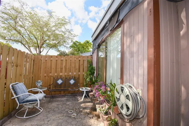 a view of a dining room with furniture and a large window