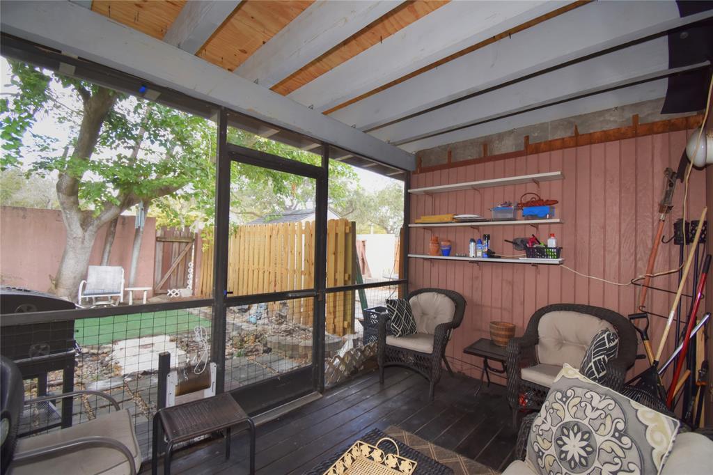 1748 Northwest 74th Avenue, Unit 19 Plantation, FL 33313 - Photo 33 of 44 a living room filled with furniture and a window