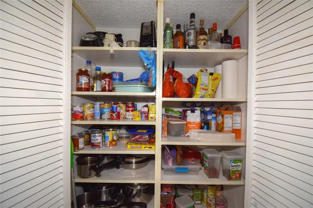 a bedroom with a bed and a mirror