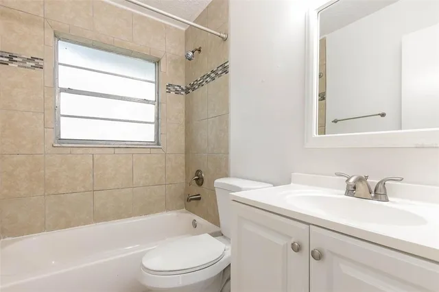 a bathroom with a sink toilet and bathtub