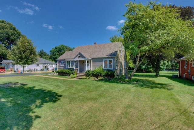 1875 Church Road Aurora, IL 60505 - Photo 1 of 26 a front view of a house with garden